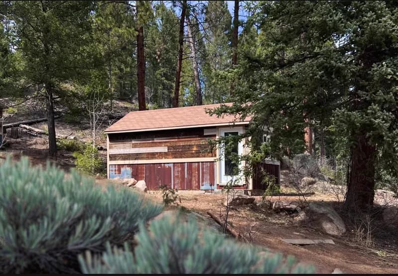 Private cabin exterior surrounded by nature