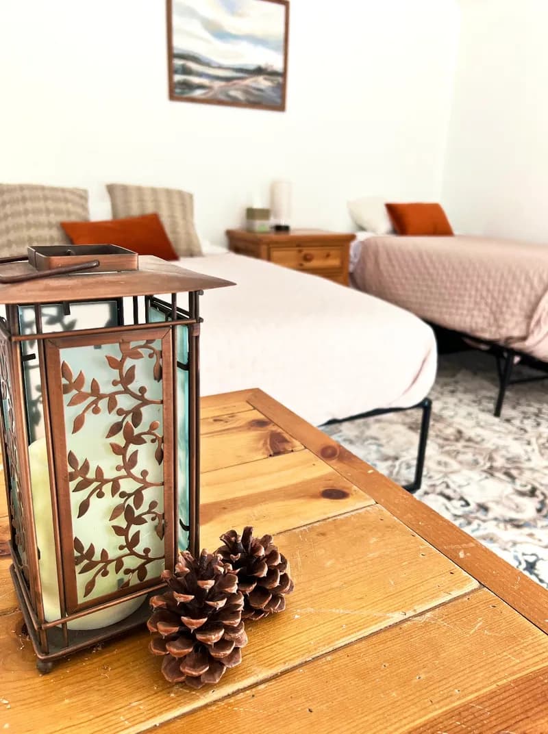 Cozy cabin interior with rustic lantern and pine details