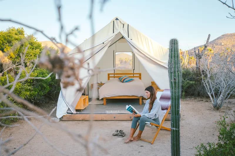 Interior of a glamping tent with natural light and comfort
