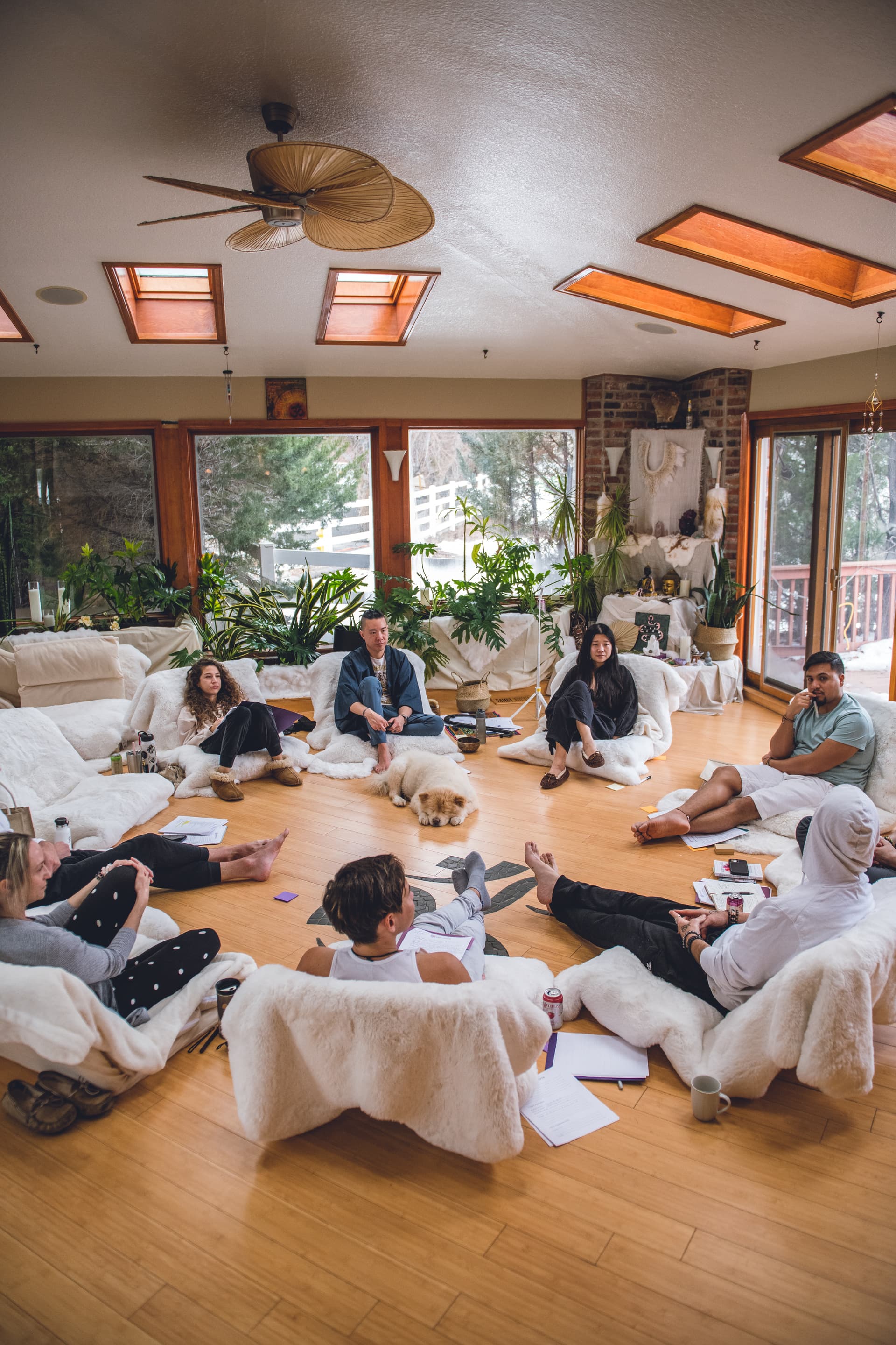 A group of people sitting on couches in a living room.